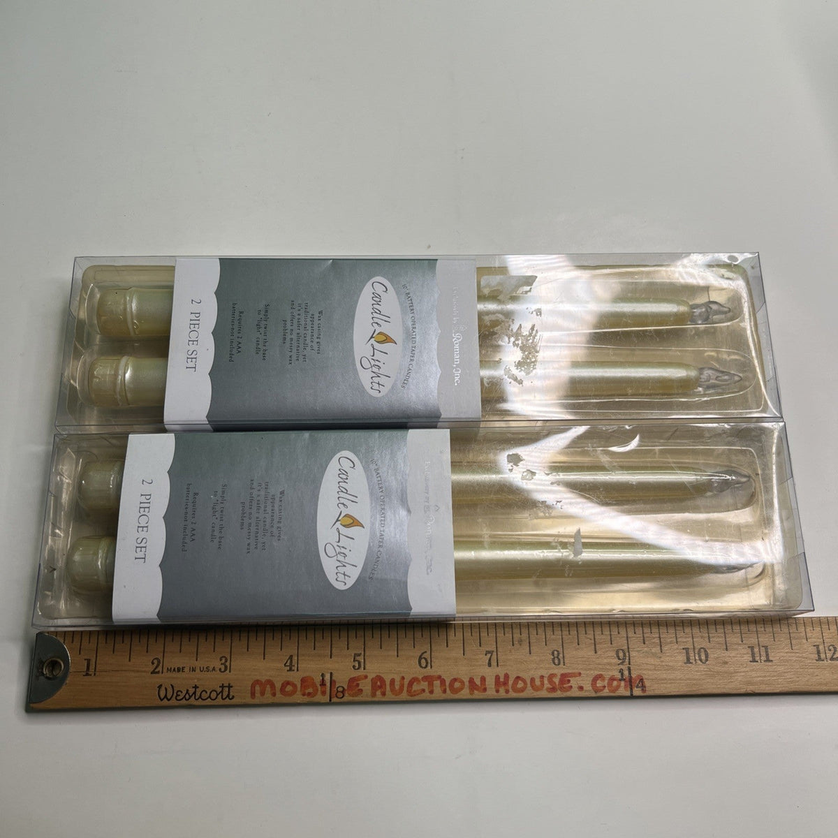 10” Battery Operated Taper Wax Candles x 4 by Roman, Inc. Requires AAA Batteries
