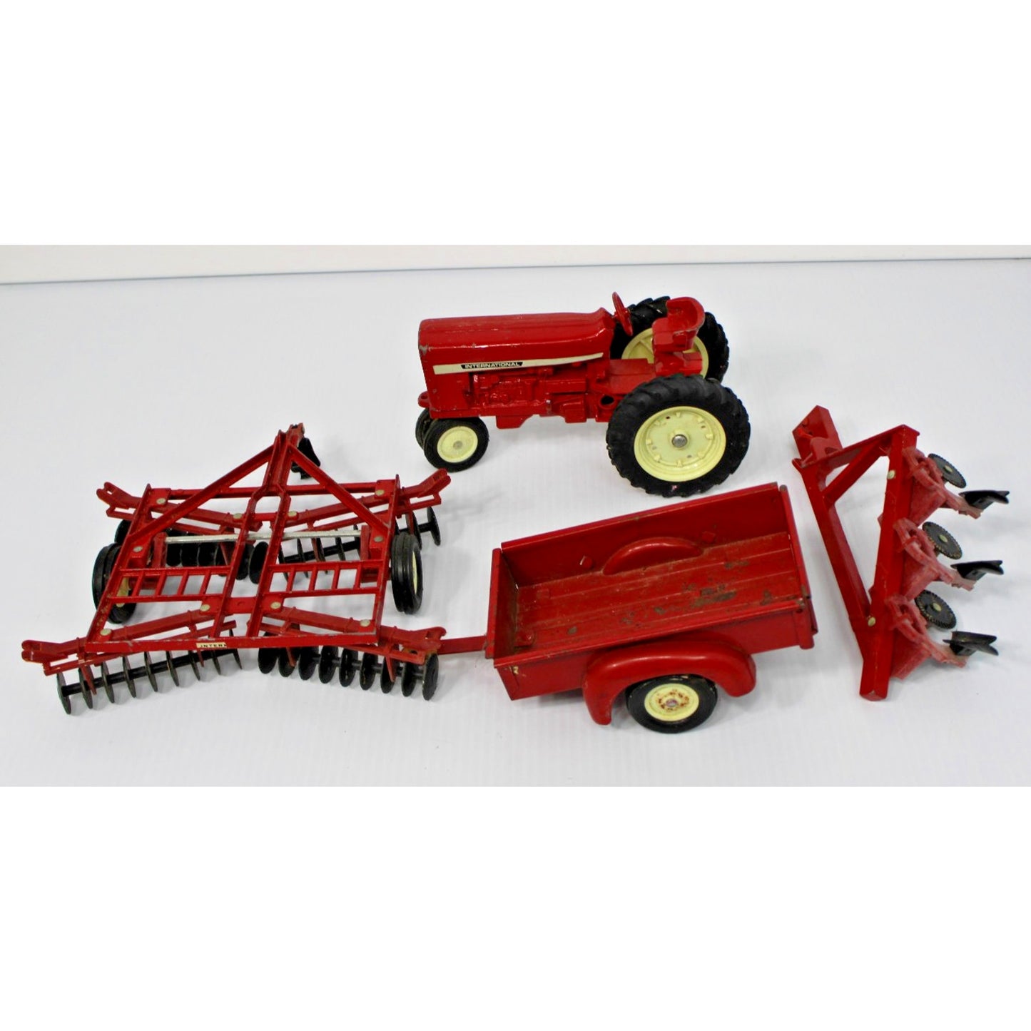 Vintage ERTL Co. 1:16 Scale Metal International Tractor, Wagon, 2 Plows Toy Set