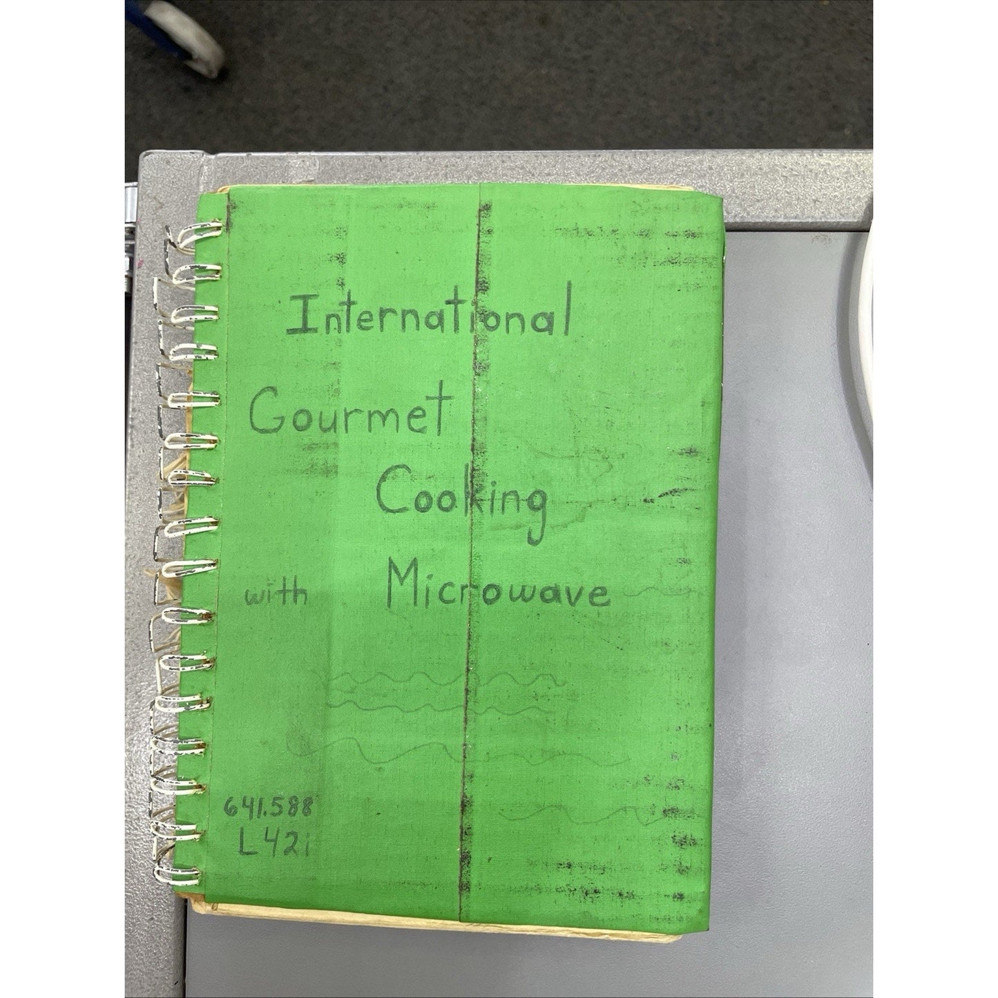 International Gourmet Cooking With Microwave by Phe Laws 1976 HC SPIRAL BOUND