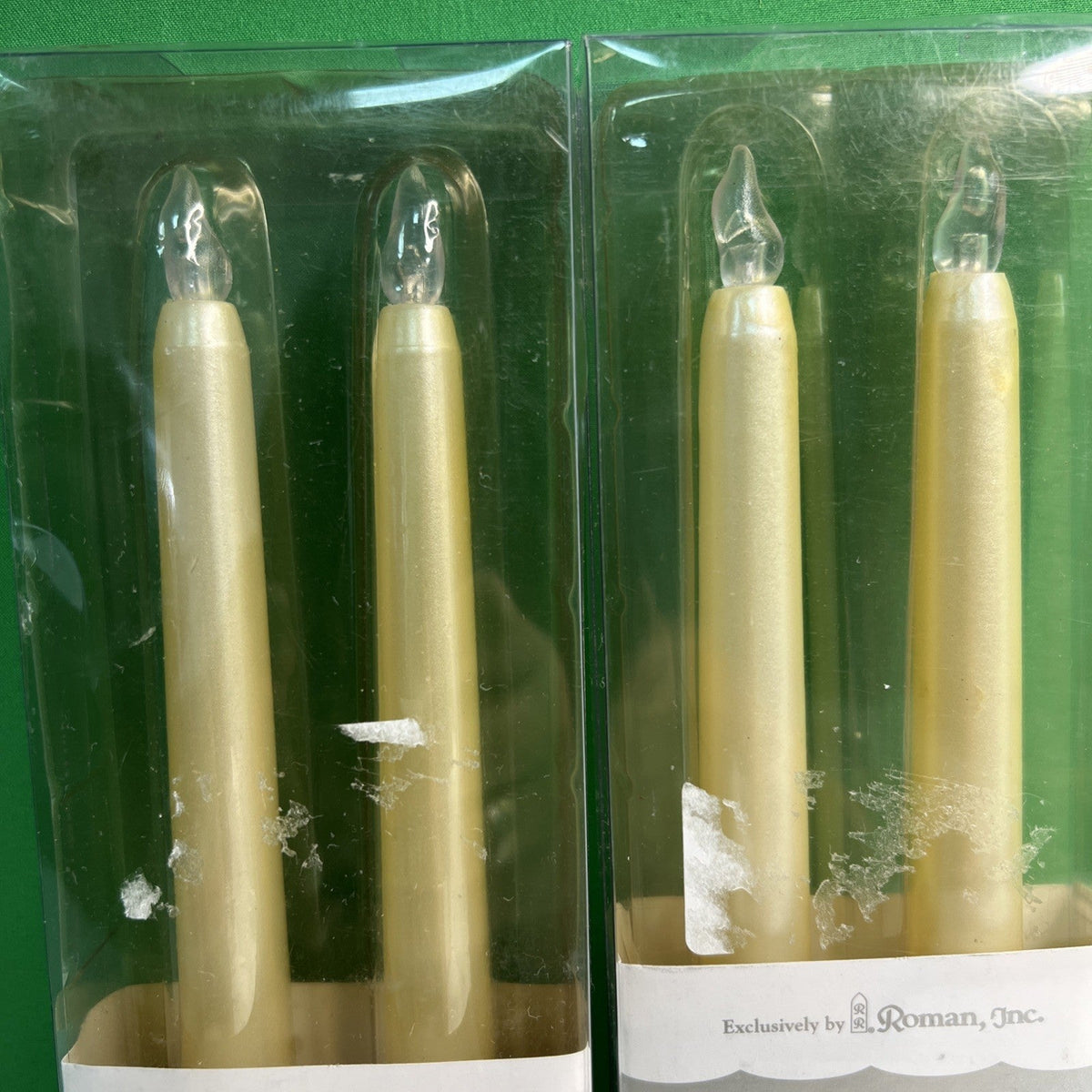 10” Battery Operated Taper Wax Candles x 4 by Roman, Inc. Requires AAA Batteries