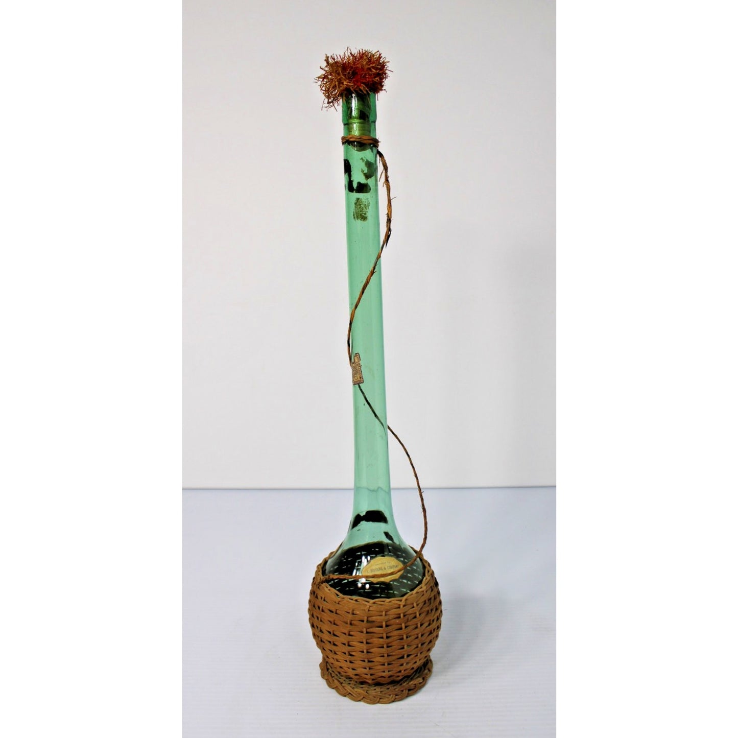 Vintage 21"H Green Glass Demijohn Carafe in Raffia, New Orleans Import Label
