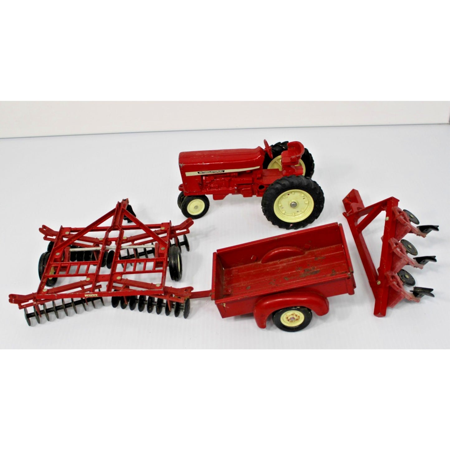 Vintage ERTL Co. 1:16 Scale Metal International Tractor, Wagon, 2 Plows Toy Set