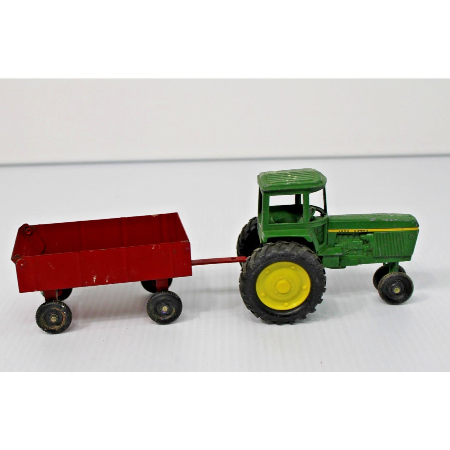 Vintage ERTL Co. Metal John Deere Tractor and Trailer Toy Set with Figure 1:16