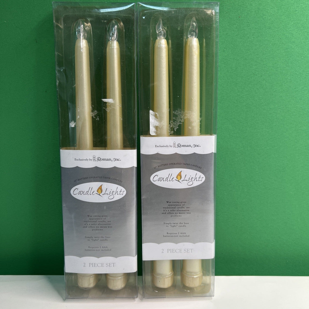 10” Battery Operated Taper Wax Candles x 4 by Roman, Inc. Requires AAA Batteries