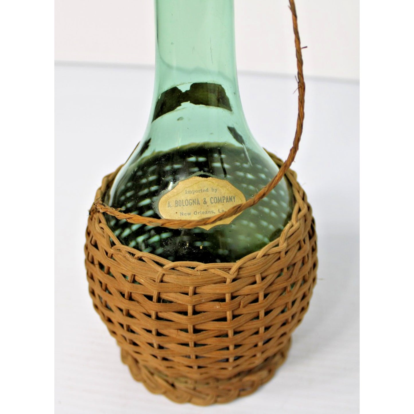 Vintage 21"H Green Glass Demijohn Carafe in Raffia, New Orleans Import Label