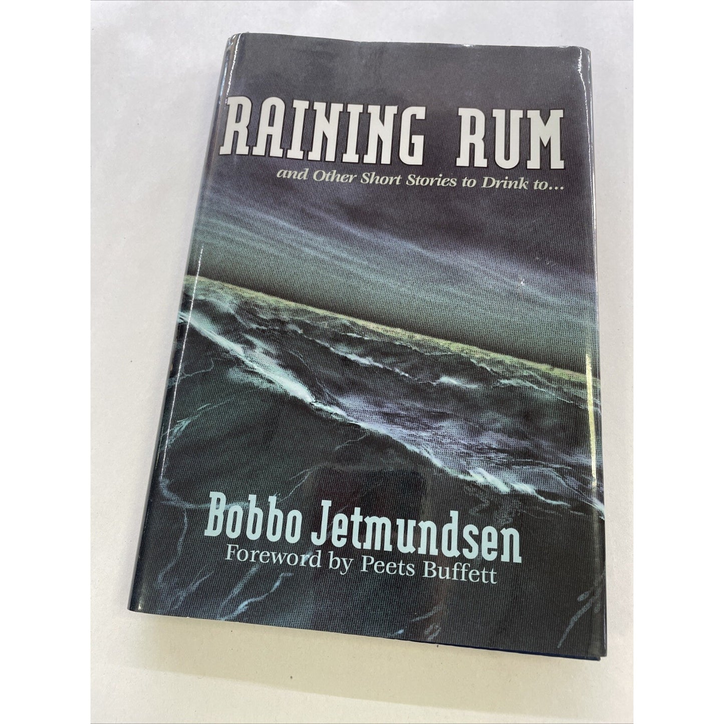 Raining Rum : And Other Short Stories to Drink To by Bobbo Jetmundsen (HC, 2004)